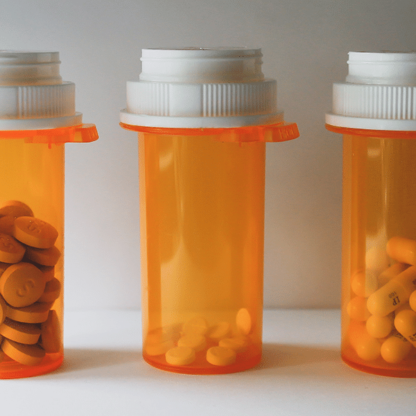 Medicine bottles with pills inside to represent that all meds, controlled and non-controlled can be e-prescribed. 