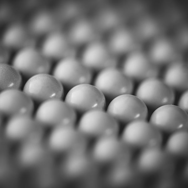 Multiple marbles to represent group insurance verification.